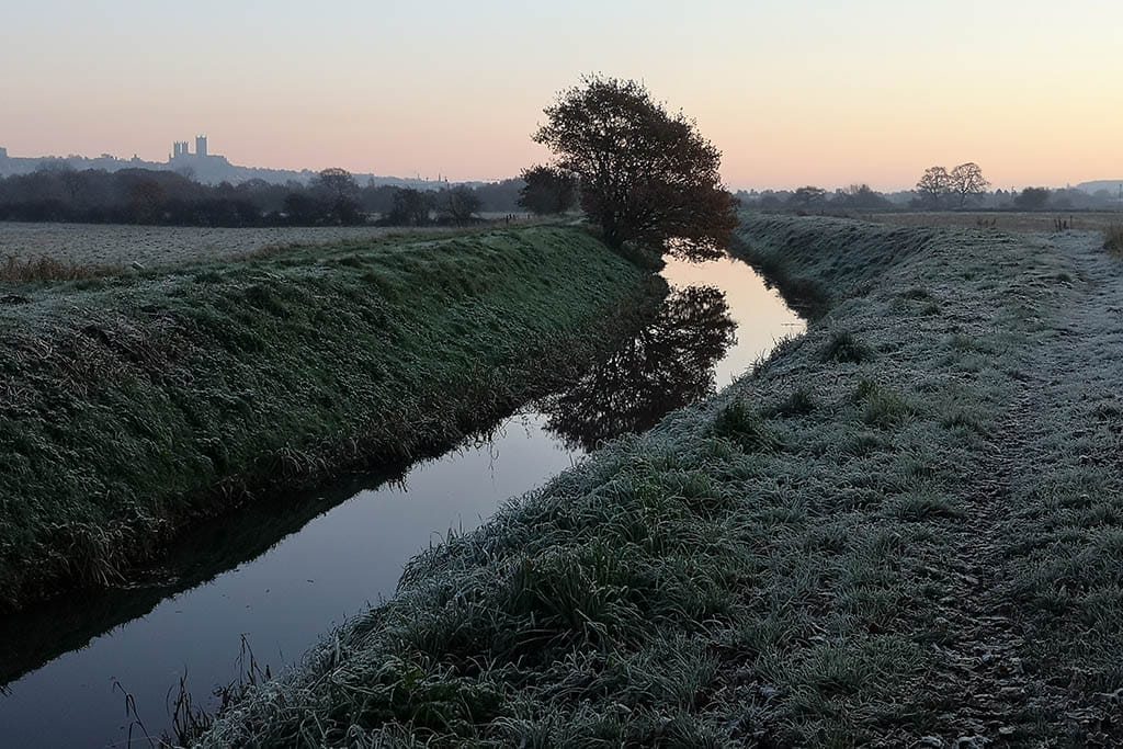 Catchwater Drain Winter Frost on the ground along the trail in winter
