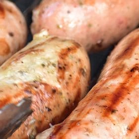Lincolnshire sausages sizzling