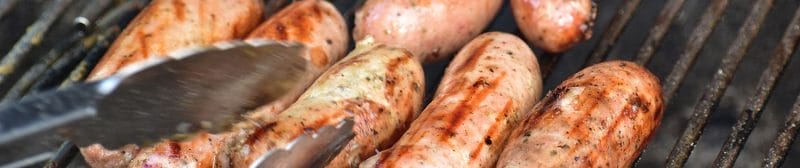Lincolnshire sausages sizzling