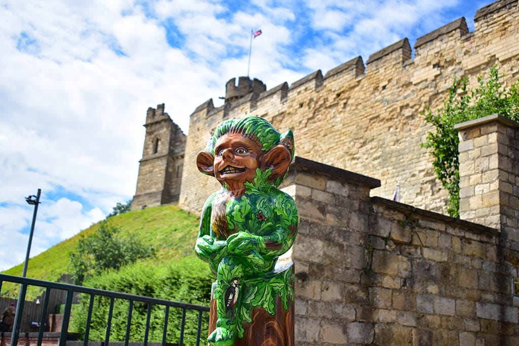 Woodland Imp Lincoln Imp Trail infront of castle