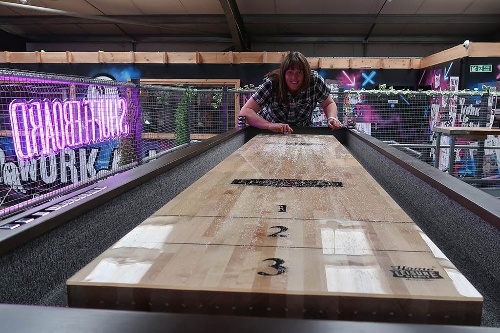 No Work Club Shuffleboard Lisa playing shuffleboard at the No Work Club