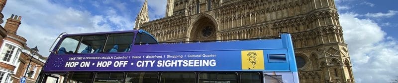 Lincoln sightseeing open top tour bus side