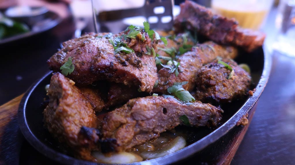 Mixed starter platter of lamb and chicken tikka, lamb chops and sheek kebabs