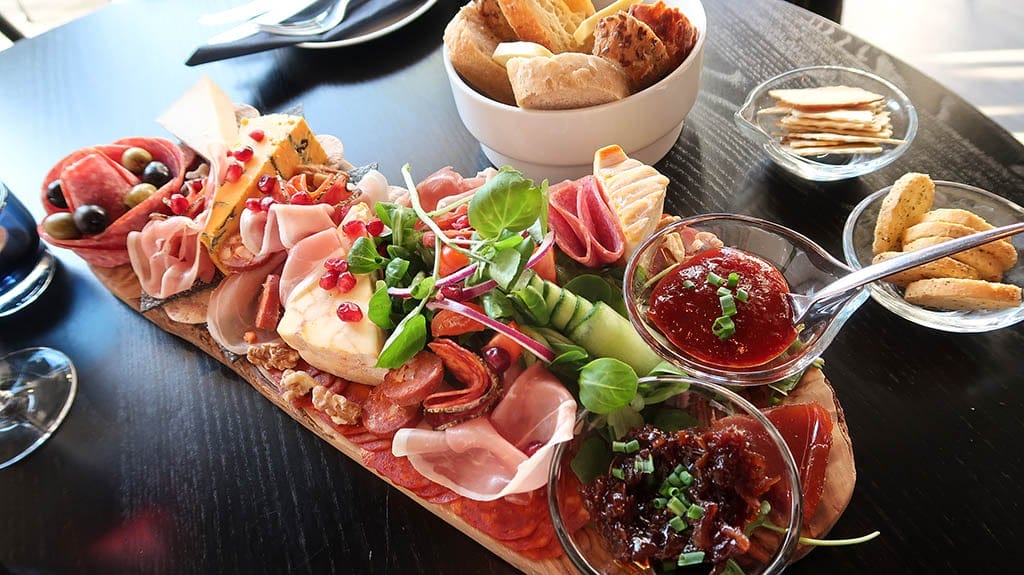 Vino Marina charcuterie board with salad garnish